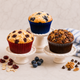Homemade bakery-style muffins made from one basic muffin batter using LorAnn Bakery Emulsions, featuring blueberry, cherry almond, and coffee chocolate walnut flavors.